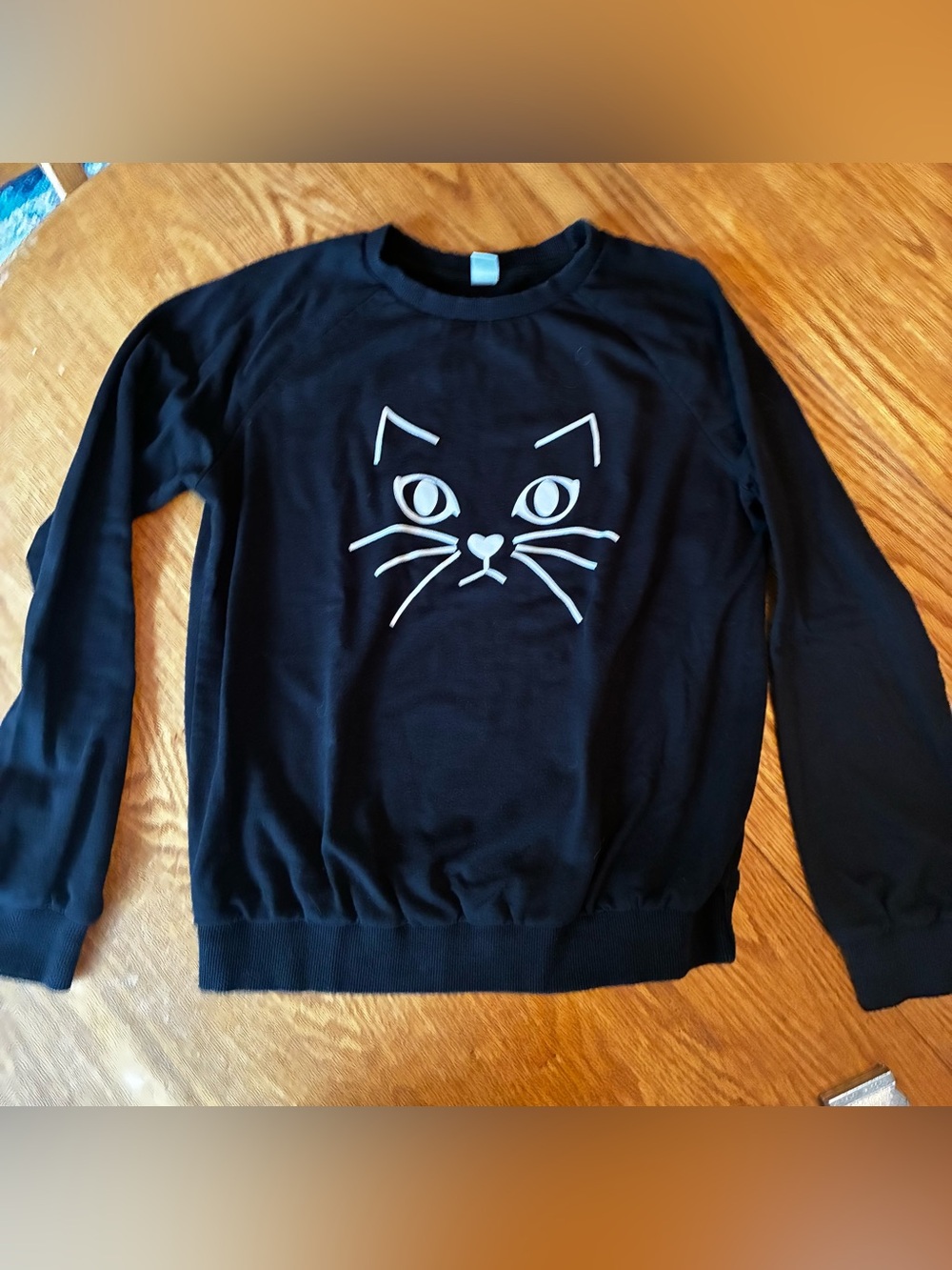 Black Sweatshirt with White Cat Face Graphic Women’s Medium